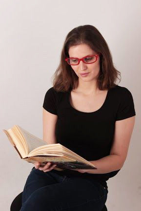 Woman with Red glasses reading